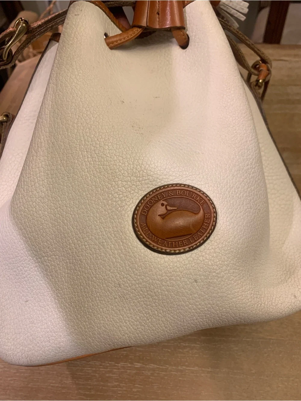 Vintage Dooney & Burke White and Brown Drawstring Bucket Bag with Tassel Accent - Picture 2 of 15